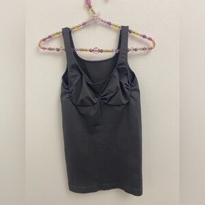 black shaping camisole or shapewear tank top with a built-in bra